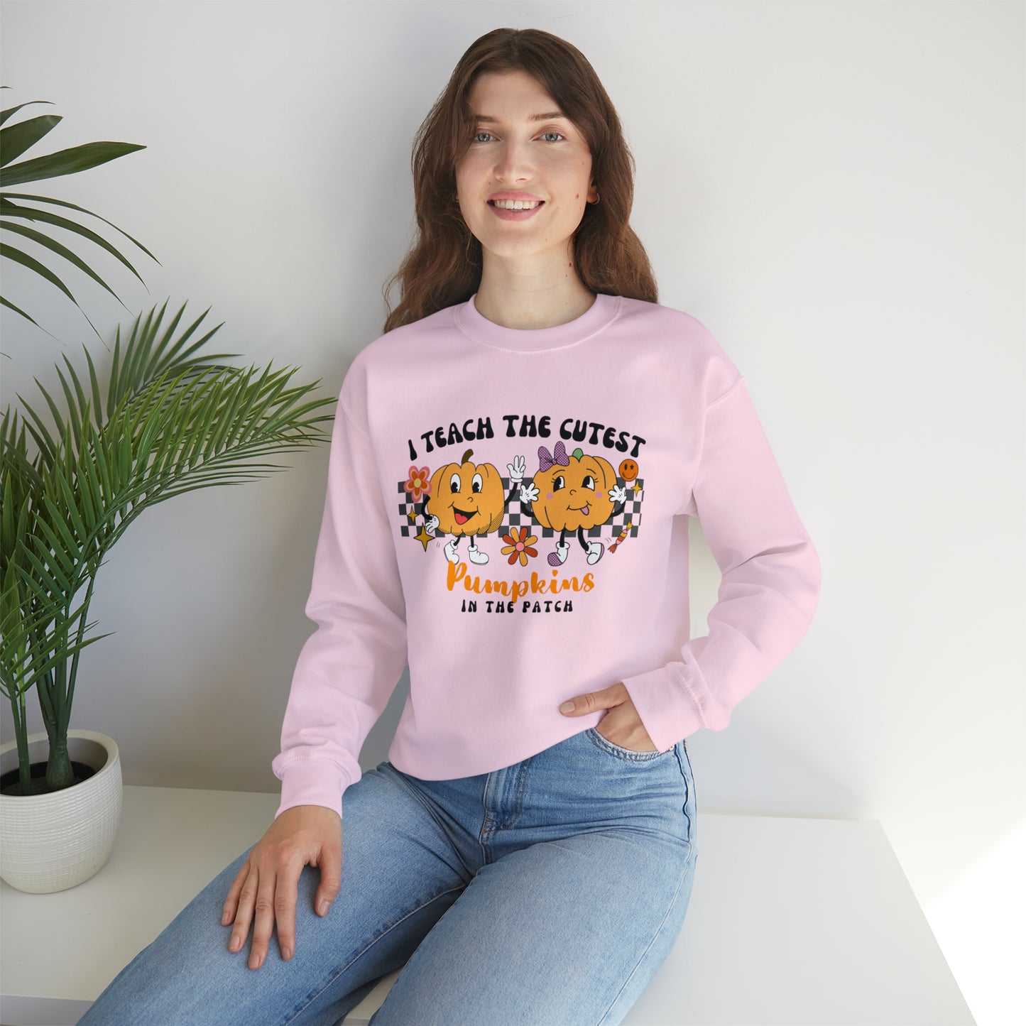 I Teach the Cutest Pumpkins Retro Unisex Heavy Blend™ Crewneck Sweatshirt