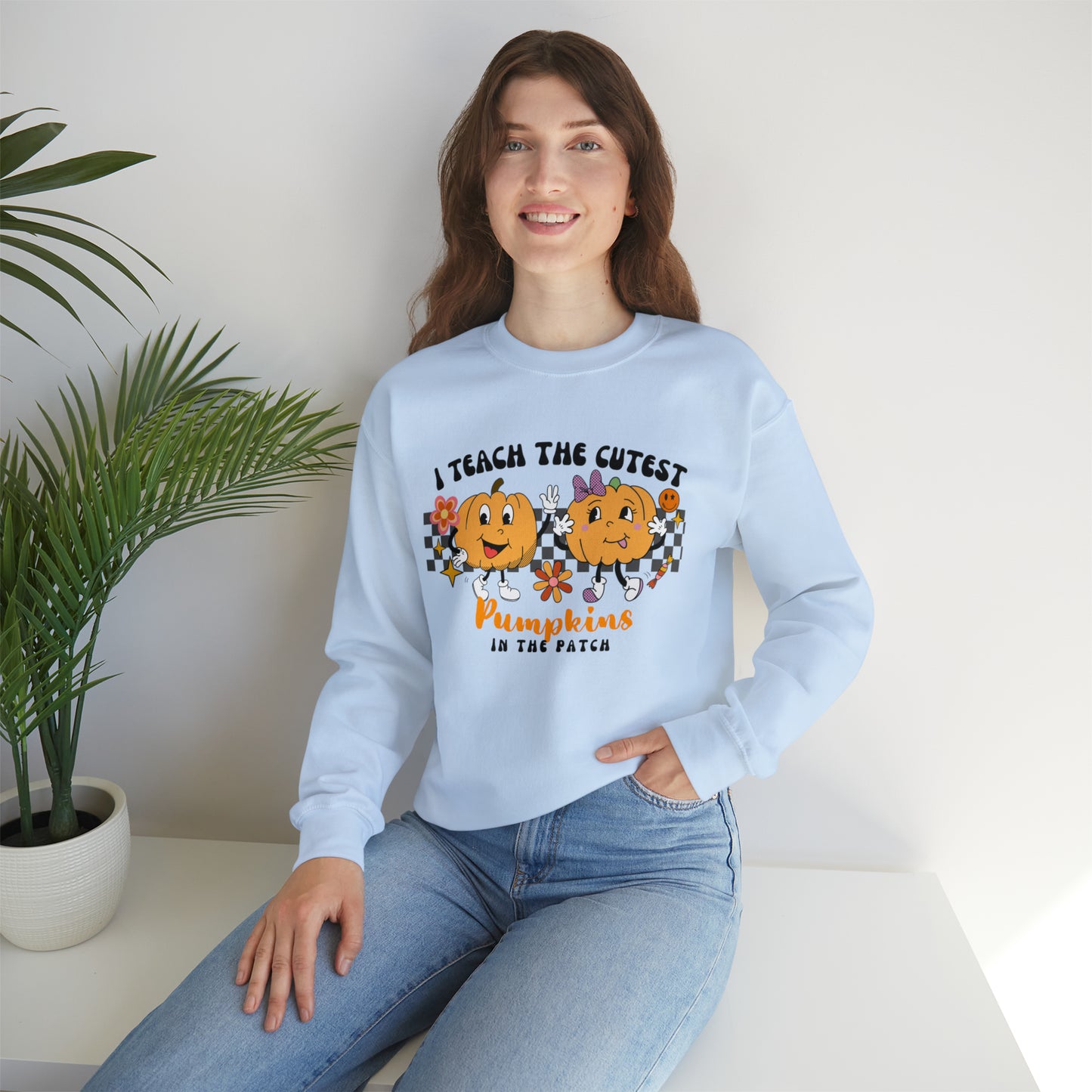 I Teach the Cutest Pumpkins Retro Unisex Heavy Blend™ Crewneck Sweatshirt