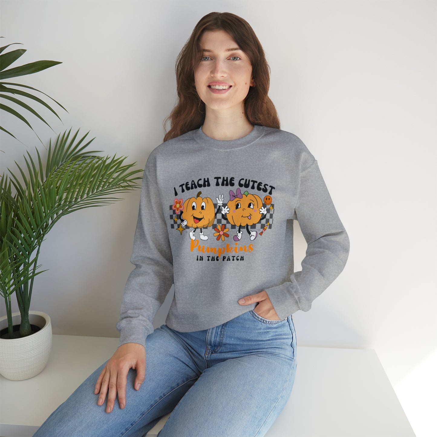 I Teach the Cutest Pumpkins Retro Unisex Heavy Blend™ Crewneck Sweatshirt